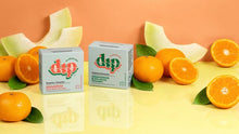 Load image into Gallery viewer, Dip Tangerine and Honeydew zero waste shampoo and conditioner bars, featured with fresh cut fruit