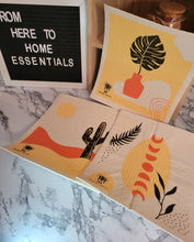 Load image into Gallery viewer, Three Swedish Dishcloths in the desert pattern laid out on a table.