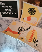 Load image into Gallery viewer, Three Swedish Dishcloths in the desert pattern laid out on a table.