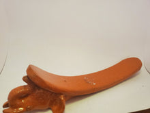 Load image into Gallery viewer, The orange elephant incense burner rests on a white sheet.