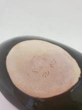 Load image into Gallery viewer, The bottom of the leaf plate with Khmer script on it and Cambodia written in English.