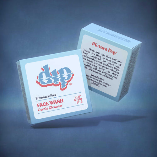 Two boxes, front and back, of dip's zero-waste, fragrance free face wash.