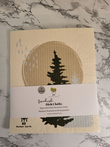 One pack of "forest" designed reusable Swedish dishcloths on a table.