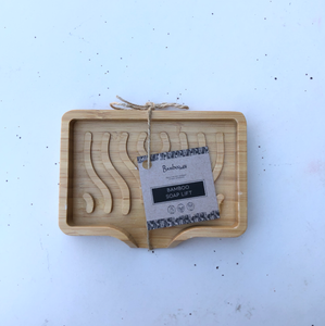 Bamboo soap dish with wavy pattern and lip to encourage draining.