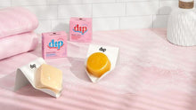 Load image into Gallery viewer, Dip&#39;s zero-waste shampoo and conditioner bars in Rosewater and Jasmine on a pink counter, bars resting in dip soap dishes, 
