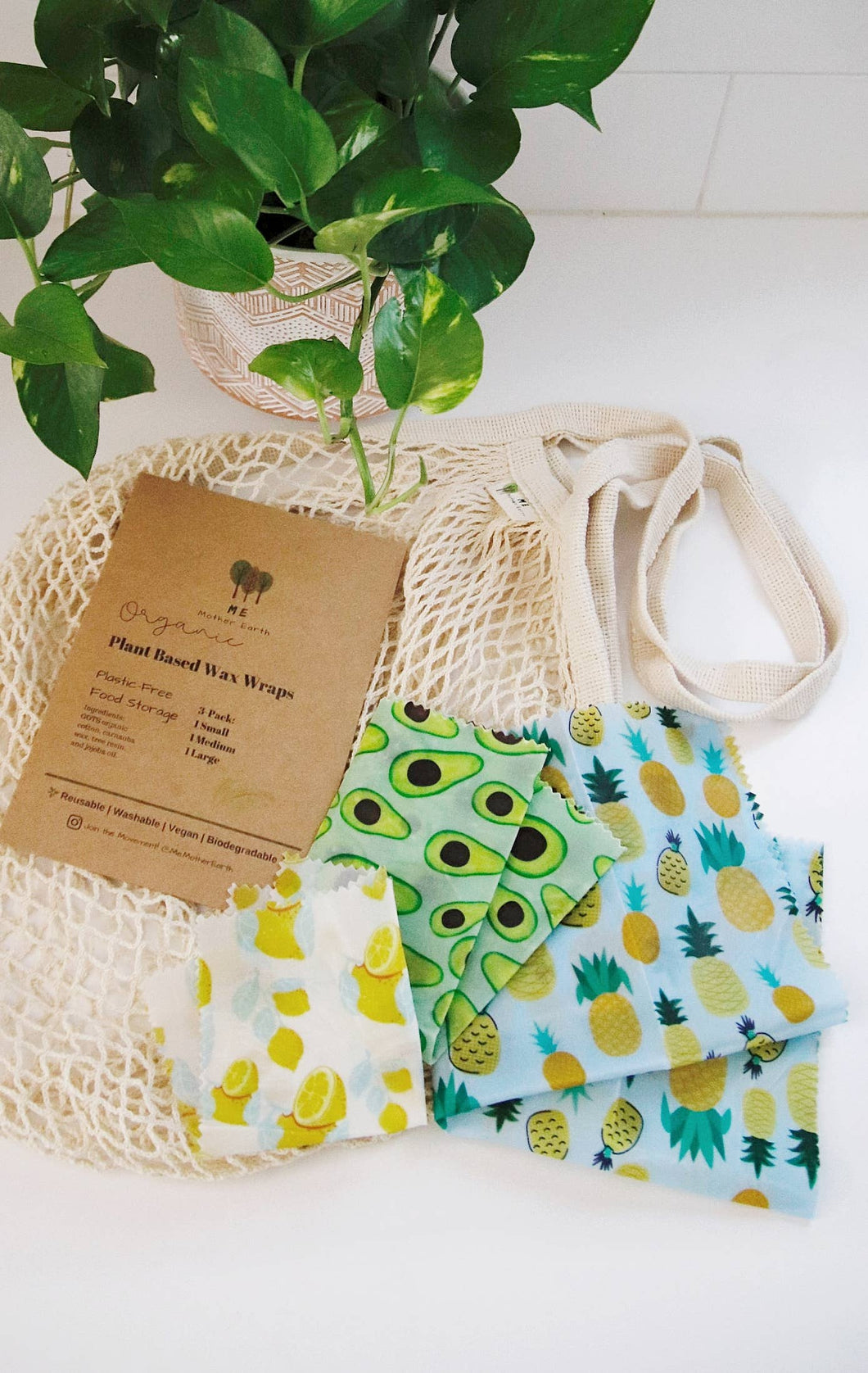Three sizes of vegan, reusable, wax wraps are shown as an alternative to plastic wrap or foil.