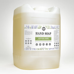 A five gallon eco-jug of Rustic Strength Soothing Herbs hand soap. The jug is part of a return program to reduce waste.